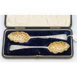 A pair of Victorian silver berry spoons, gilt bowls, cartouche engraved with monograms, hallmarked