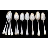 A collection of George IIII silver Old English Pattern table spoons, all engraved with initial/s.,
