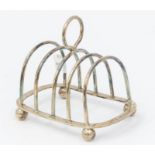 A George VI silver five bar toast rack, loop handle, on ball feet, by Chatterley, London, 1936,