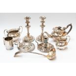 Various plated items including a three piece tea set, pair of candlesticks, two chamber sticks