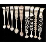 Nine mainly 19th Century various ornate silver sugar nippers, various dates and makers, approx 9.