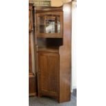 A Liberty & Co quartered oak glazed corner cabinet from 1907 (illustrated on page 113, Liberty's