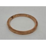 A 9ct. rose gold bangle, Birmingham 1924, external diameter 8.3cm. (17.9g)