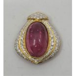 **WITHDRAWN**An 18ct. yellow gold and pink tourmaline brooch, having large oval pink tourmaline in