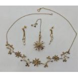 An early 20th century 15ct. yellow gold and seed pearl set star pendant/brooch, diameter 30mm, (