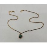 An 18ct. gold and green turquoise pendant, suspended from 18ct. gold cable chain, length 50.5cm. (