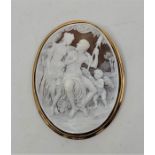 A large 18ct. gold mounted oval carved shell cameo pendant/brooch, height 7.8cm. (gross weight 29.