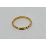 A precious yellow metal wedding band, marks for London 1933, (yellow metal assessed as gold of at