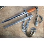 German Army Officers dagger with scabbard, lanyard and belt suspension.