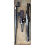 A Reproduction wheellock pistol 56cm long and two bayonets one 1853 pattern socket bayonet (