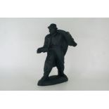 A Russian black pottery figure of a riveter  Height 16 1/2"