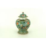 A Chinese porcelain baluster from vase with domed lid, painted in Wutsai with two phoenix birds with