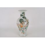 A Chinese porcelain baluster form vase painted in colored enamel with Shao Lu and attendants The