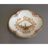 A Meissen quatrefoil saucer, painted with a scene of merchants at a quayside with sailing boats, the