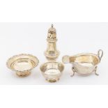 A group of table silver to include: 1. George V caster, hallmarked S Blankensee & Co., Birmingham,