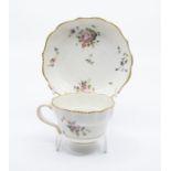 An unusual Chelsea Derby ogee moulded tea cup and saucer, anchor and D mark in gilt, dentil gilt