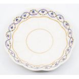 A Derby outside decorated fluted circular dish, c.1800, decorated with a border pattern of