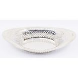 A George V silver shaped oval bread basket with reticulated sides, hallmarked by Barker Brothers,