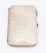 A George V silver oblong shaped cigarette case, plain engraved with presentation inscription HGF