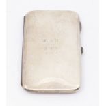 A George V silver oblong shaped cigarette case, plain engraved with presentation inscription HGF