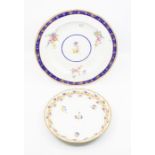 A Derby 24cm dinner plate, decorated with a Smith’s blue border and gilt grapes and vine, above