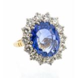 A large sapphire and diamond 18ct gold dress ring, comprising an oval mixed cut sapphire approx 9.28