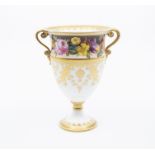 A Royal Crown Derby two-handled pedestal vase, painted with spring flowers, signed Albert Gregory,