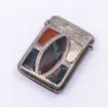 An Edwardian silver and hardstone vesta case, the cover inset with shaped hardstones within engraved