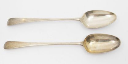 A pair of George III silver Old English pattern serving spoons, each engraved with a crest, by