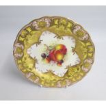 A Royal Worcester Dessert Plate. Yellow, Pink, and Gilt ground. The centre painted with Peaches