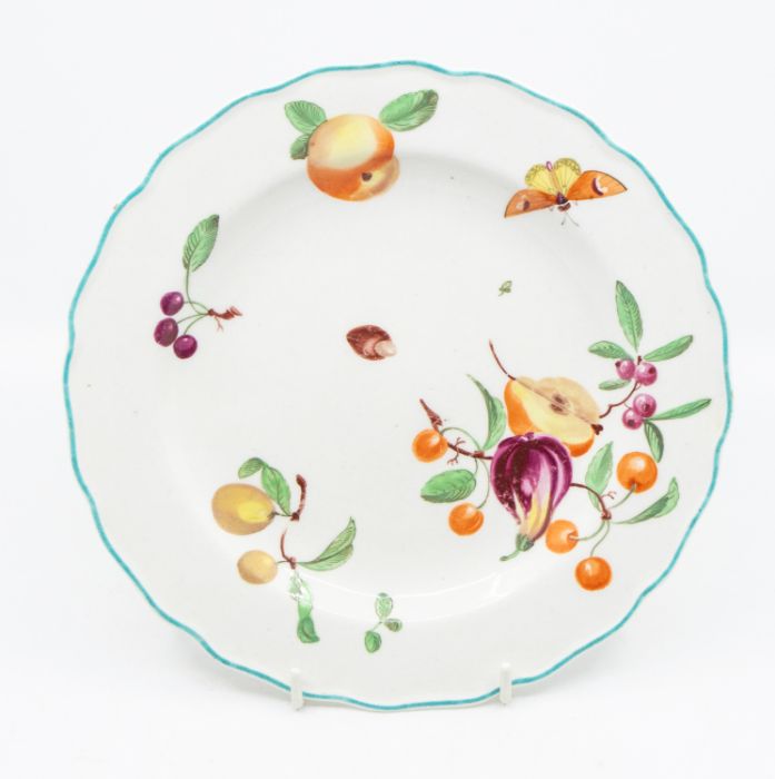 A red anchor Chelsea dessert plate, circa 1765, decorated with fruit and insects, within a turquoise