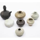 A group of four celadon jarlets, a small Qingbai box and cover, a black glazed jarlet, and a small