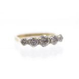 A five stone diamond and 18ct gold ring, comprising five graduated round brilliant cut diamonds,