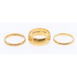 Three 22ct gold wedding bands, various widths, sizes P and O, combined weight approx 16.6gms