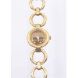 A ladies 9ct gold Eterna wristwatch, comprising a round tigers eye quartz dial with white hands,