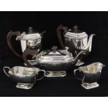 An Elizabeth II silver matched five piece silver tea and coffee service to include: teapot, sugar