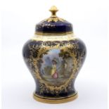 A Coalport porcelain pot pourri and cover, cobalt blue body decorated with gilt leaf and foliage