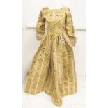 An 18th Century dress comprising slub taffetta silk of a lime coloured grograin fabric trimmed