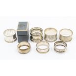 A collection of seven various late 19th/20th Century silver napkin rings, various dates and