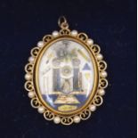 Masonic Interest: an early 19th century oval masonic pendant, depicting the all seeing eye,