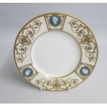 A Minton Very Fine Plate with Pate sur Pate classical heads, set within raised gilt fan panels.