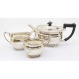 A Georgian style silver three piece tea service comprising teapot, sugar bowl and milk jug, all with