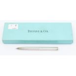 A Tiffany & Co retractable ball point handbag pen in sterling silver, in original pouch and