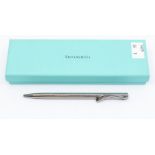 A Tiffany & Co silver retractable ballpoint pen, designed by Elsa Peretti, along with presentation