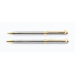 A Tiffany & Co. T-Clip chrome and gold plated twist ballpoint and mechanical pencil set.  In