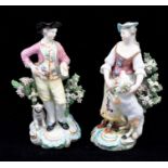 A pair of Derby patch mark figures, The Garland Shepherds, the Lady wears a bonnet, pink corset