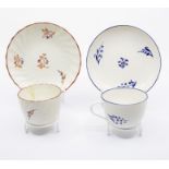 A Pinxton tea cup and saucer, pattern no.2 blue sprig, c.1796-99, saucer approx 14.5cm diam;
