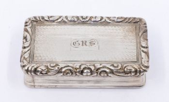 A George III silver snuff box, with cast scrolling flower and foliate border above reeded sides, the