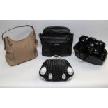 A group of four handbags, including a Lulu Guinness black basket ware bag, with white leather