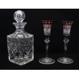 A pair of Bohemian style red flashed cut glass liqueur glasses, on long faceted stem together with